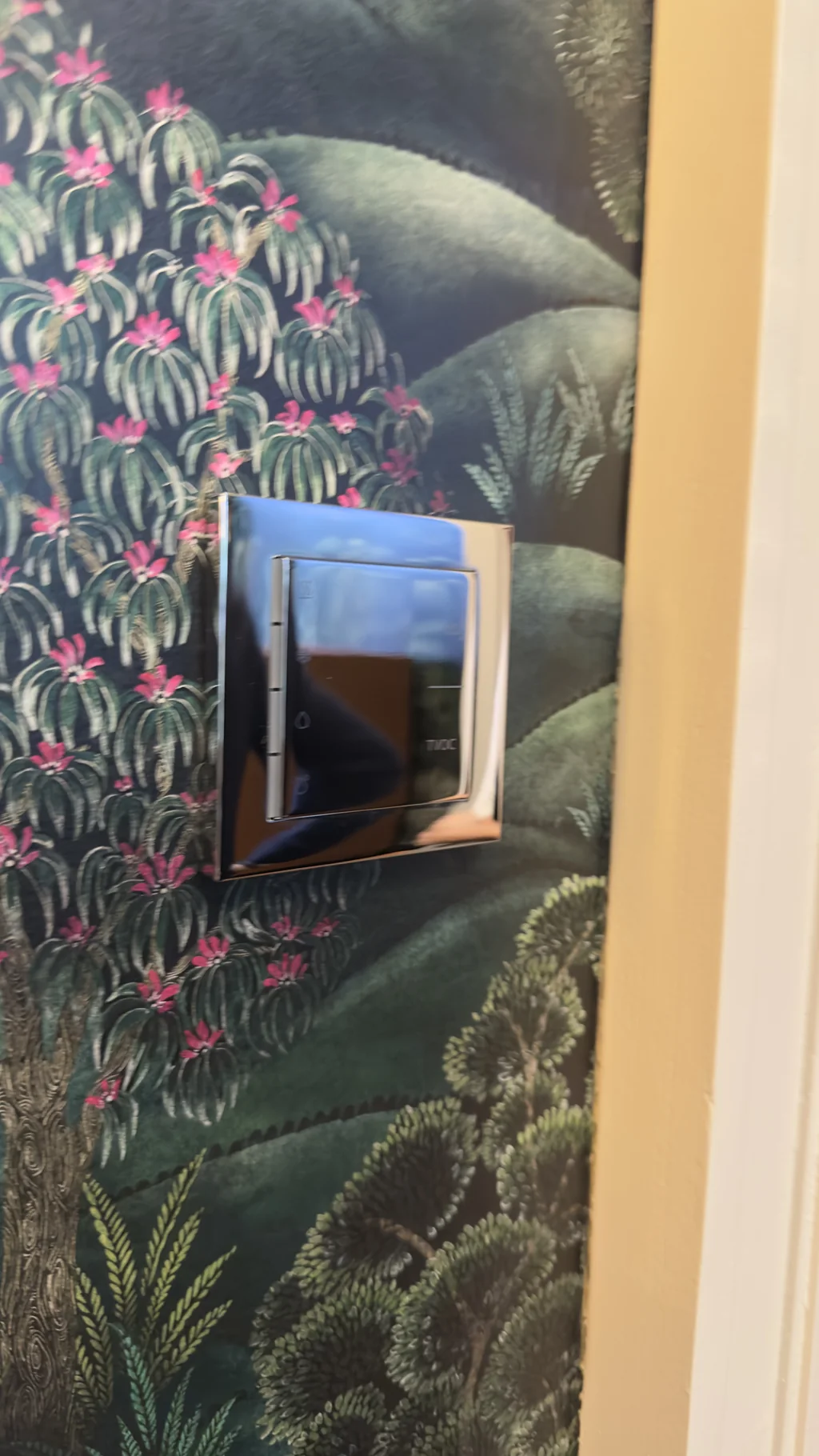 Ekinex keypad set against botanical silk wallpaper