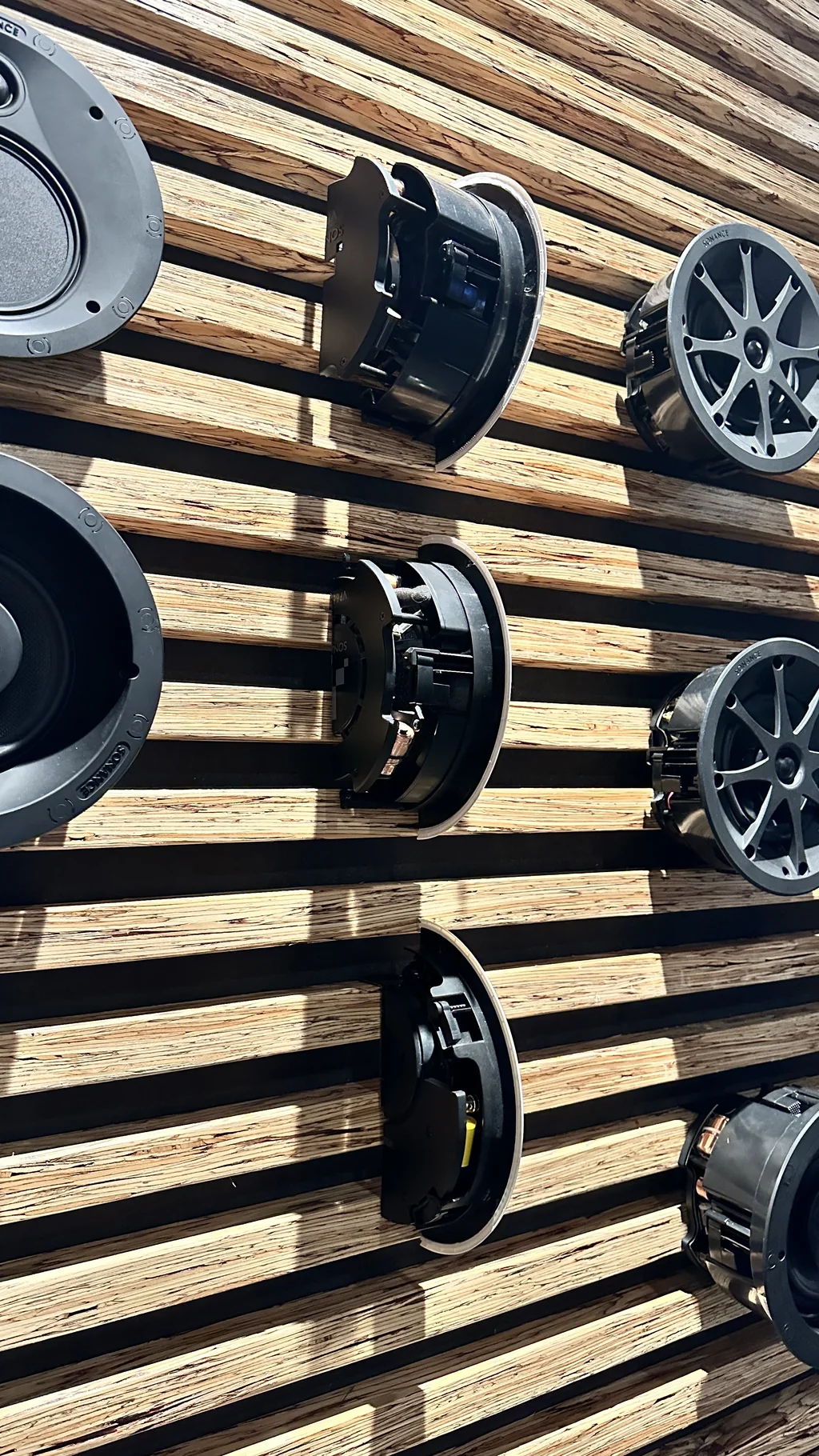 Wall display of Sonance speaker drivers at the San Clemente headquarters