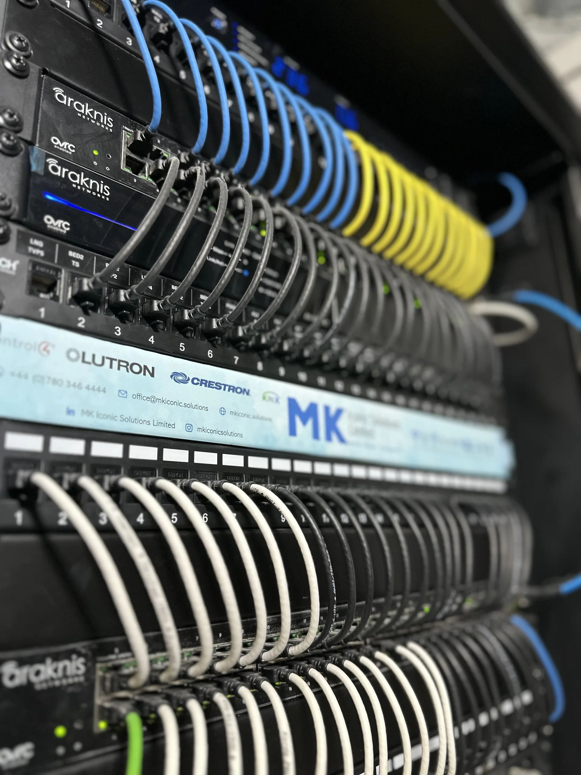 Immaculately dressed MK Iconic Solutions network and control rack — the engineered system Iconic Care™ monitors and maintains